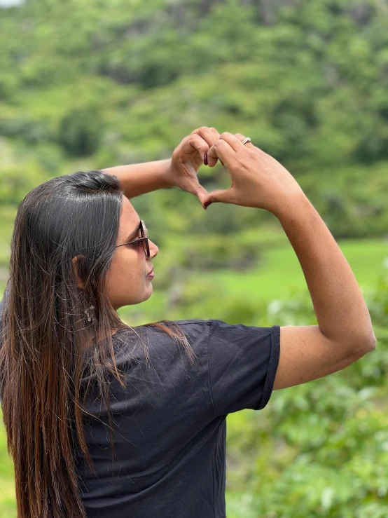 a girl with long hair is wearing black