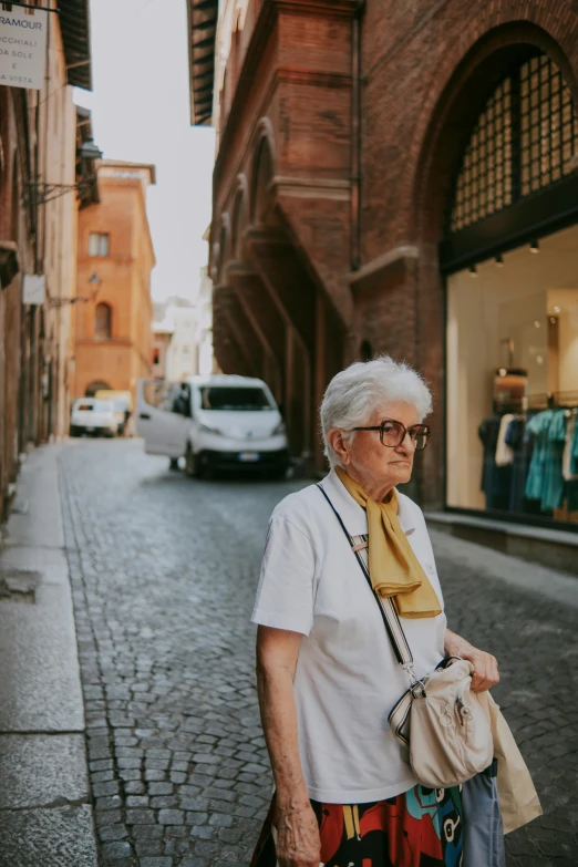 a woman walking down an empty alley way