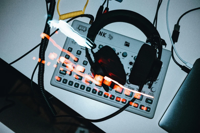 a couple of typewriters on a desk with headphones