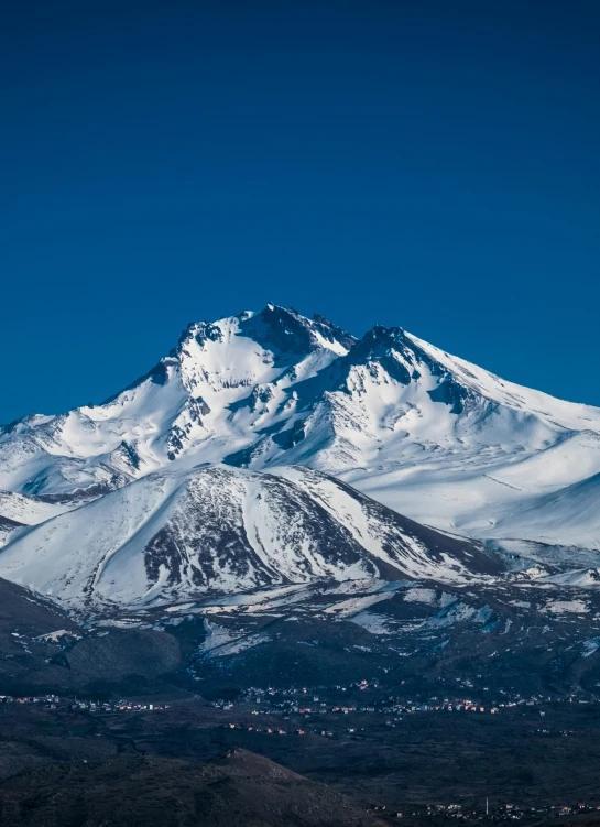 a large mountain that is covered with snow