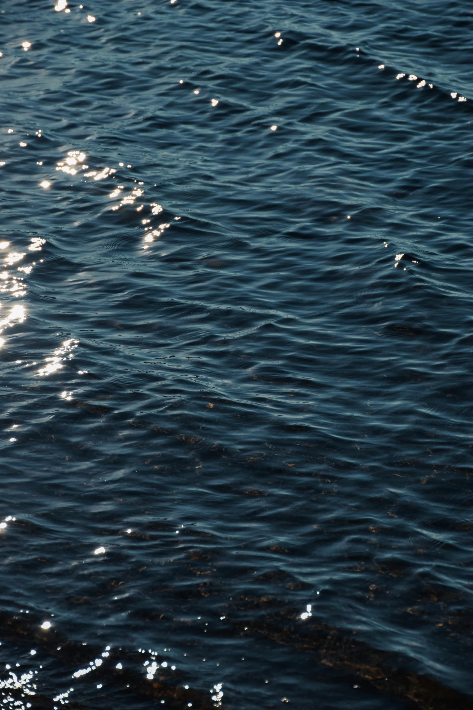 a boat sitting on top of the ocean