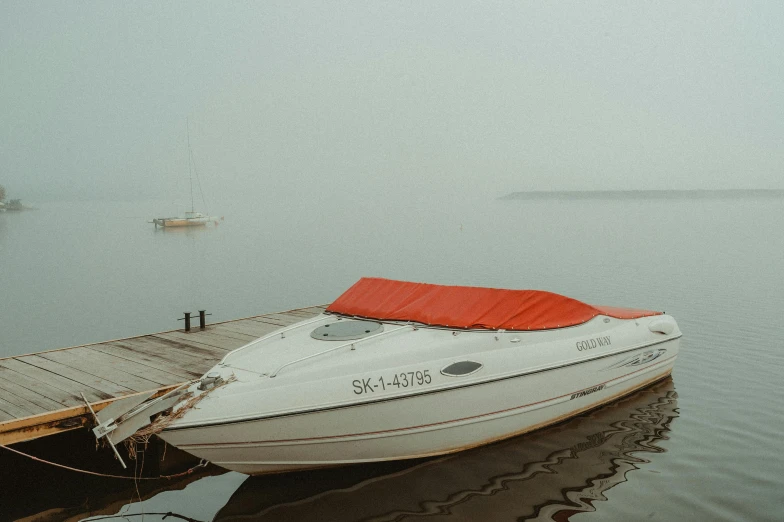 a white boat that is sitting in the water