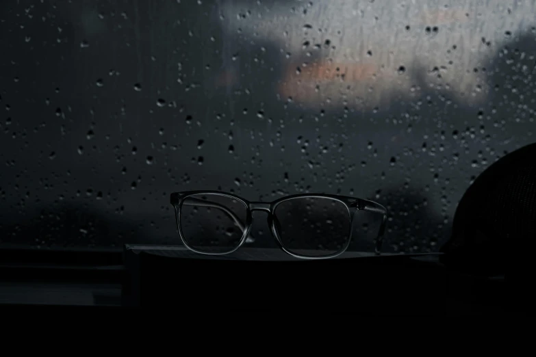 a pair of glasses is sitting on the edge of a counter