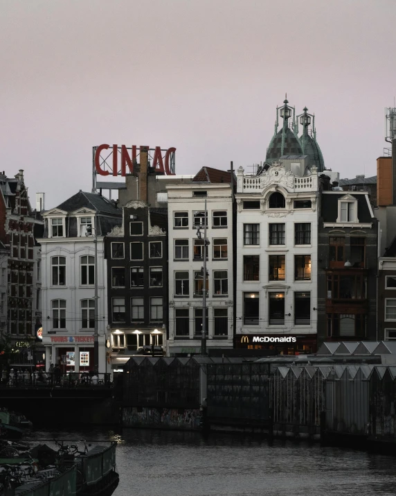 buildings next to the water with buildings around them