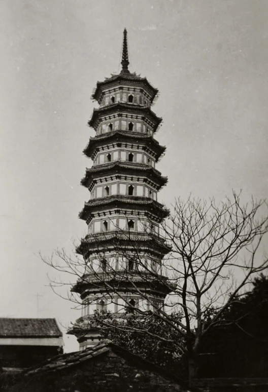 a very tall building with trees in the background