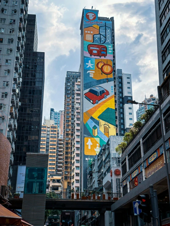 an oriental street has a tower with paintings on it