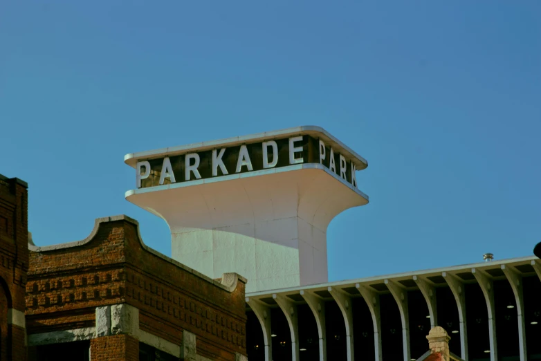 a large brick building with a large water tower