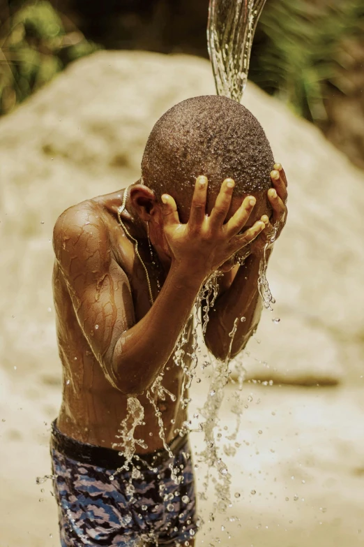 a  playing with a water hose