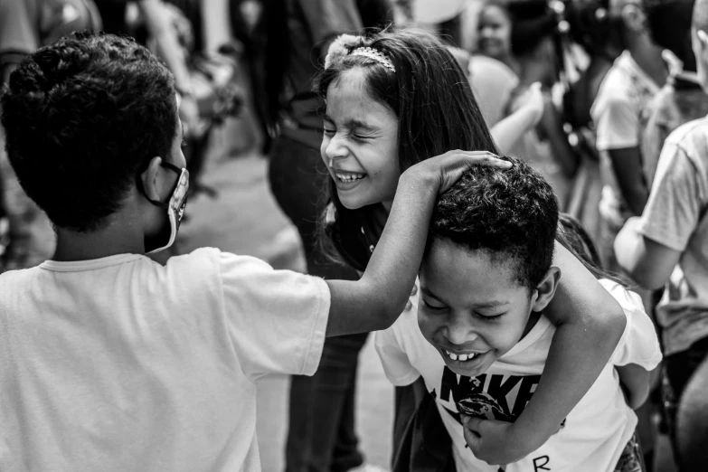 two children with hands around each other