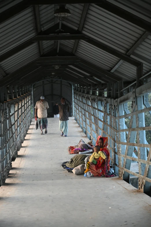 two men walking on an open air structure