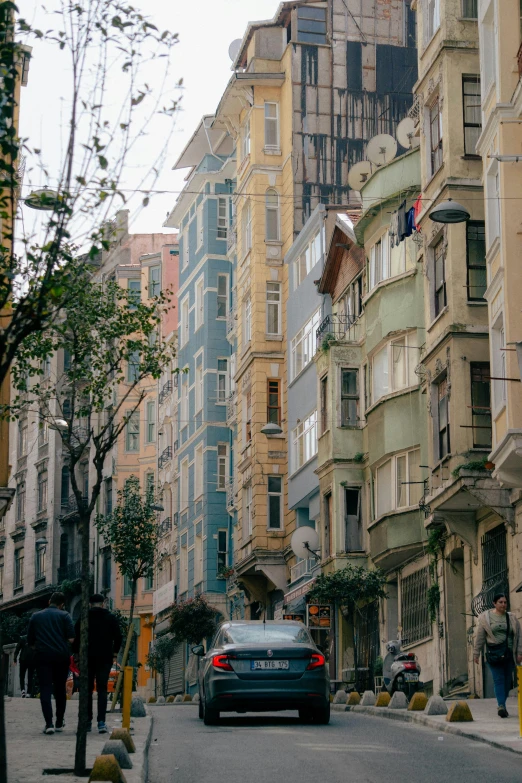 an empty city street with tall buildings in the background