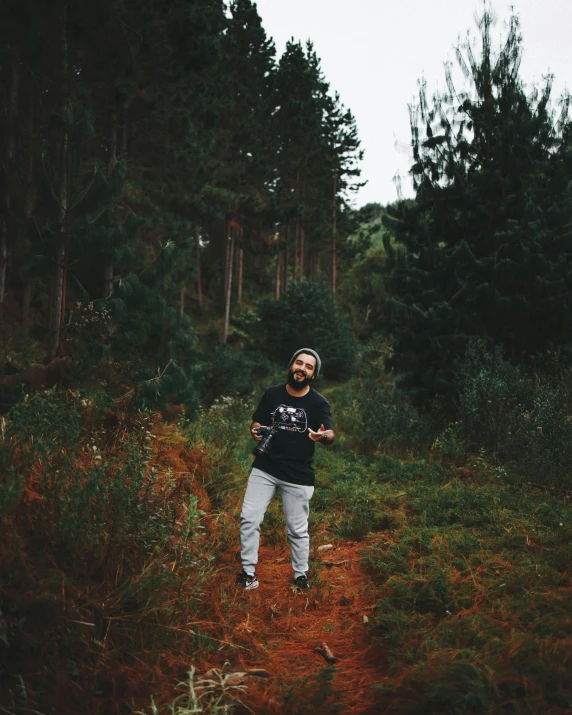 a man is throwing soing into the air in a field