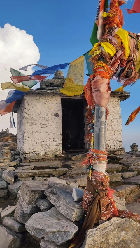 a couple of kites hanging from the top of some rocks