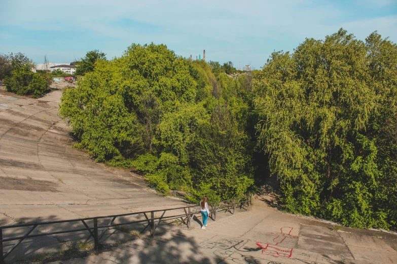 there are people walking down a steep ramp