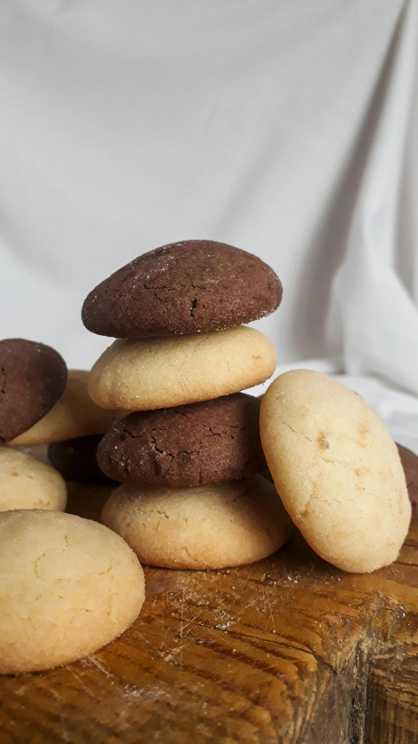 some cookies stacked up on a table near one another