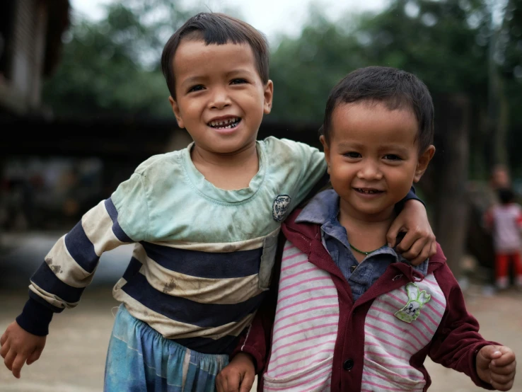 two small children smiling together by themselves