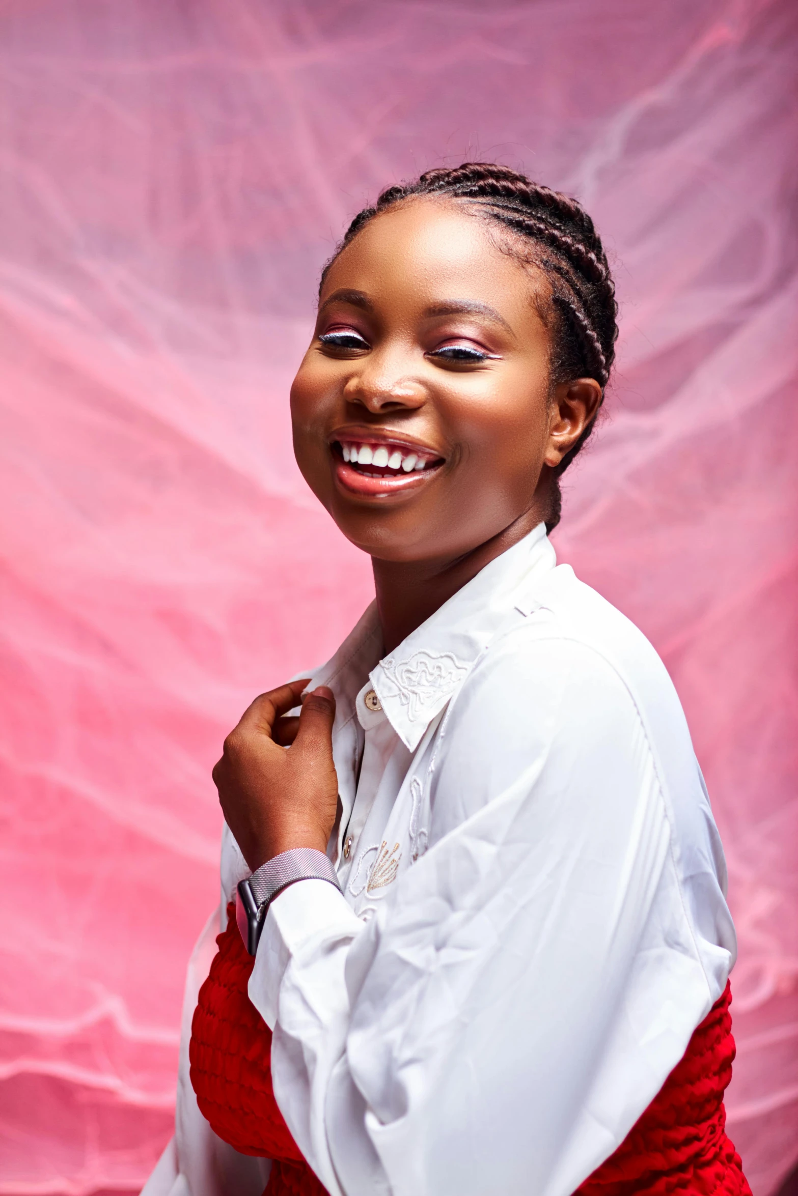 a woman is wearing a red skirt and smiling