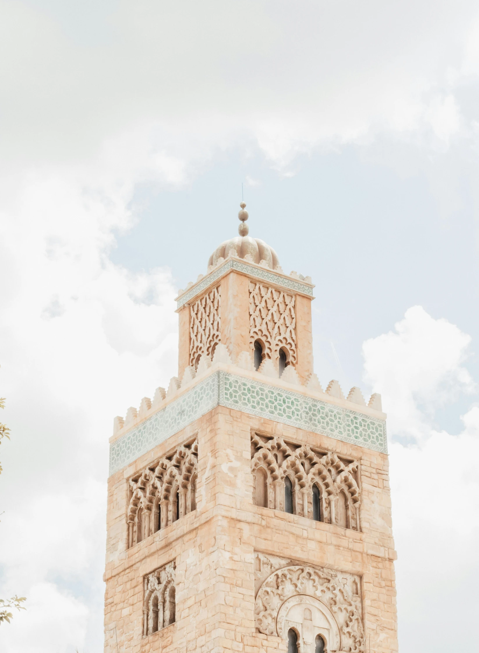 the tower is made of stone and features a domed roof