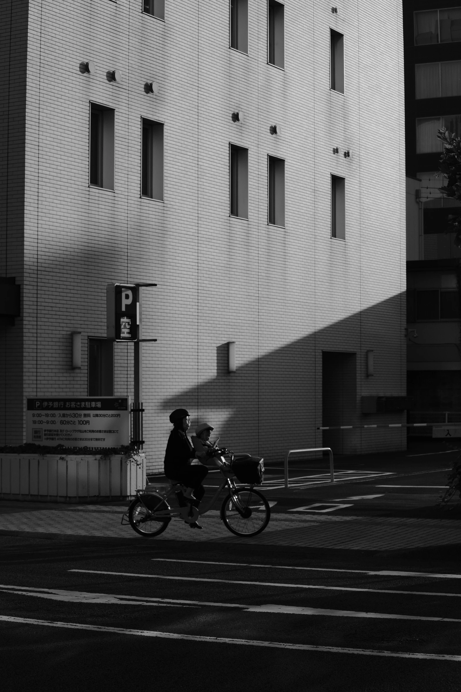 a man on a bike on a street