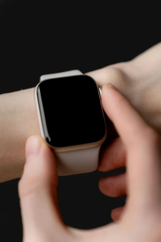 a person holding on to a apple watch