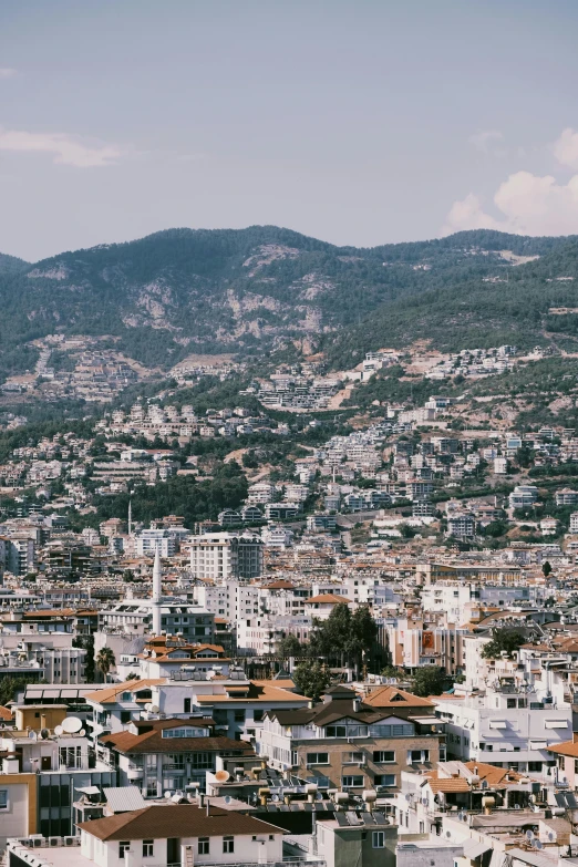 a po taken of a hill side city from the height of a mountain