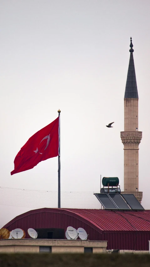 a flag on the top of an old building