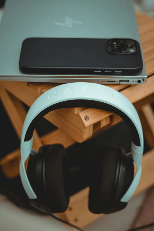 a cell phone and headphones on a table