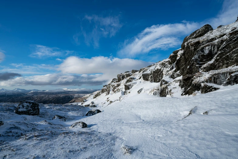 a snow covered mountain near the top of it