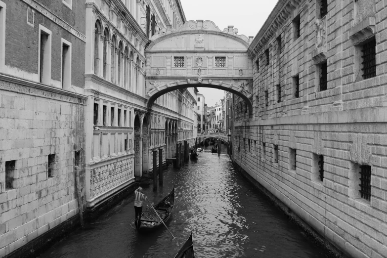 a boat on a body of water near buildings