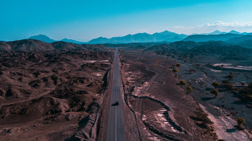 a scenic road winding up in the desert