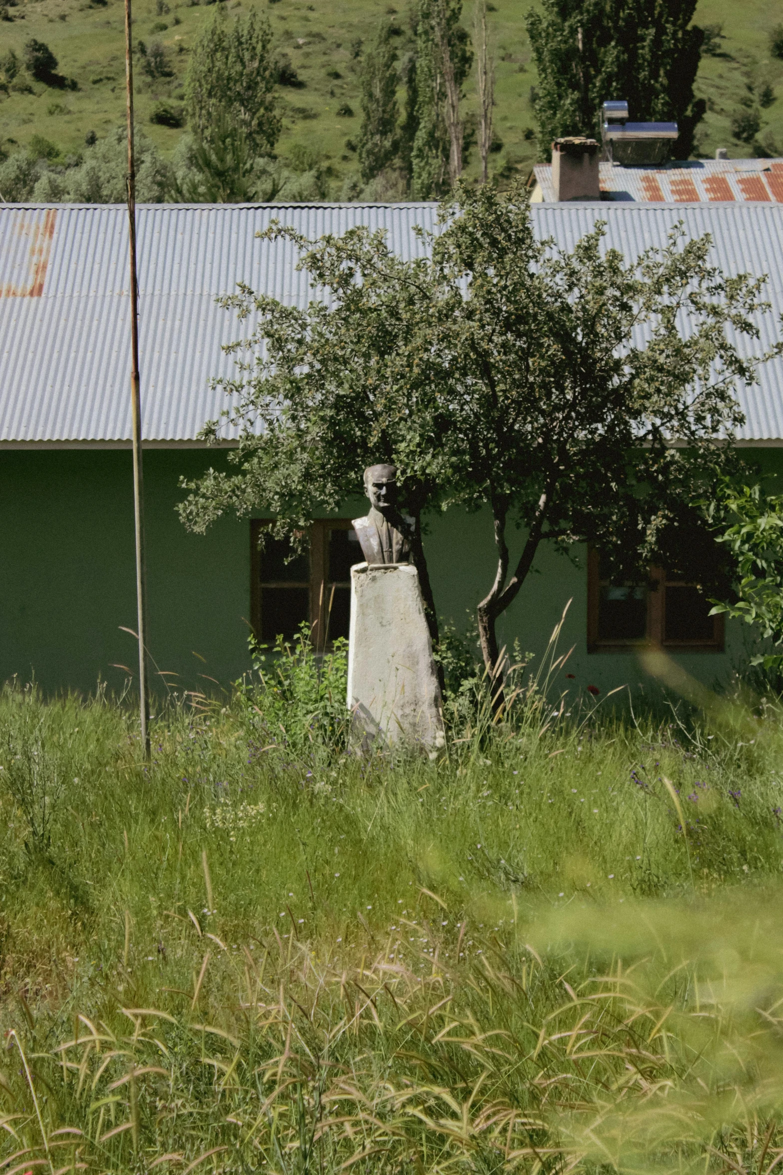 the statue is in the front of the building