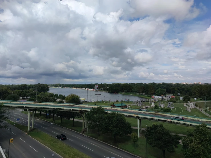 a bridge over a road leading into the distance