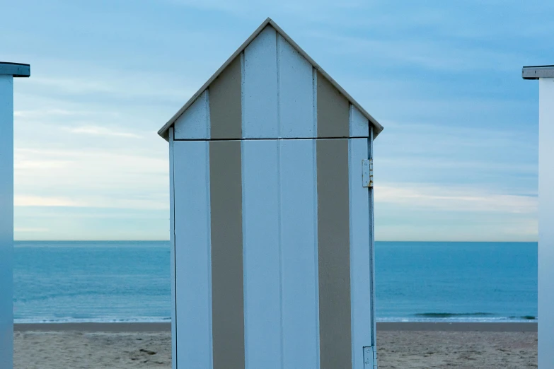 the sky and sea with no clouds over two tall structures