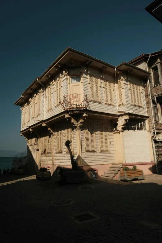 an old building sitting on the side of a street