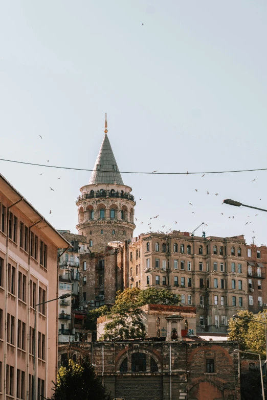 a view of buildings in the city with a domed building behind them