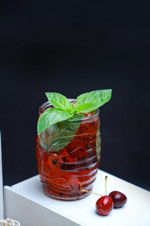 a drink sitting on top of a white box