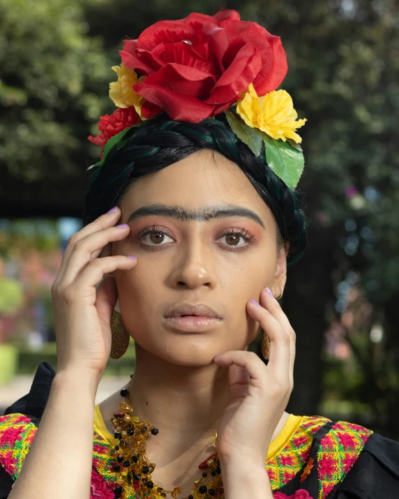 a beautiful young woman dressed in mexican clothing