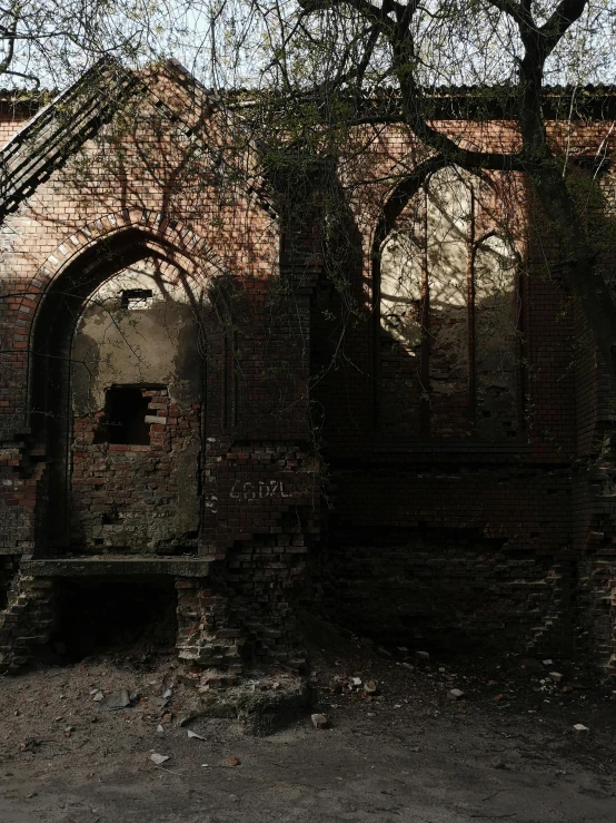 a building with archways and windows is shown in shadow