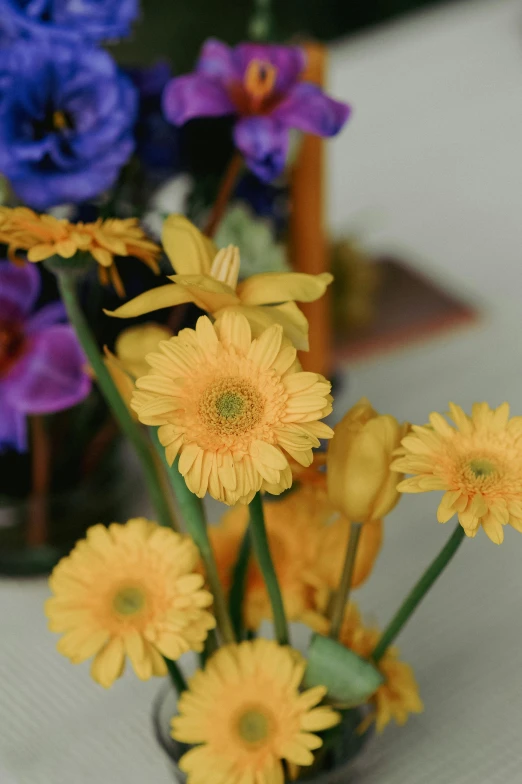 many different flowers are on display in a vase