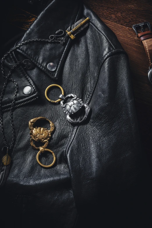 an old leather jacket with gold hardware and metal decorations