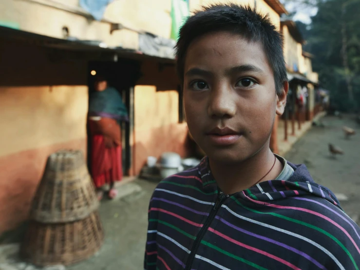  with black hair outside a village