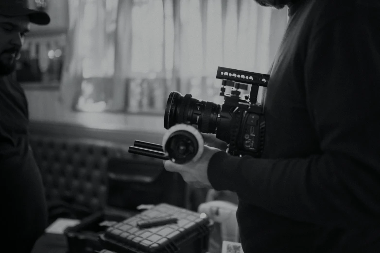 a man taking soing in front of a camera