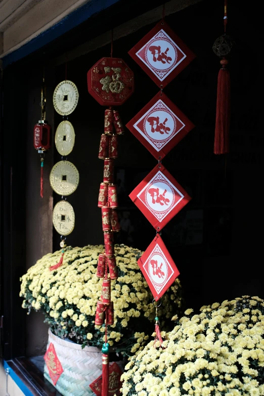 decorative red and white decorations above a window