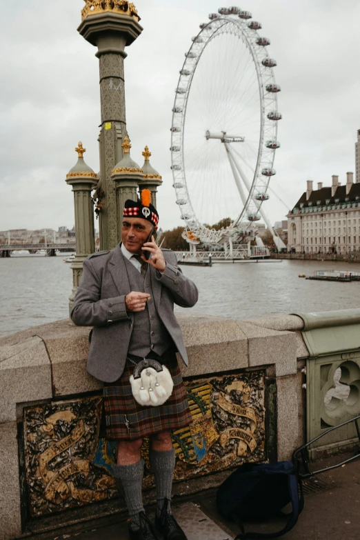 a man that is on the side of a bridge