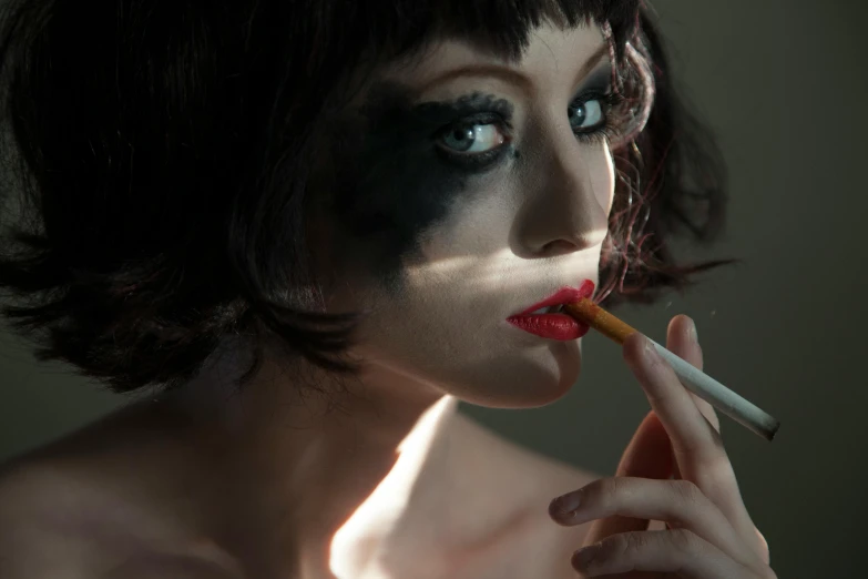 an image of a girl with makeup that is smoking a cigarette