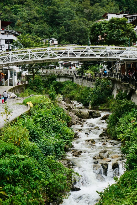 an overview of the river and bridge at an outdoor venue