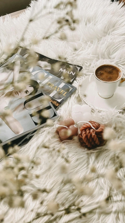 a white fluffy rug topped with a cup of coffee