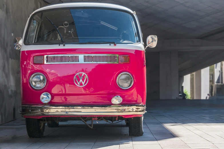 the old style bus is parked in a parking lot