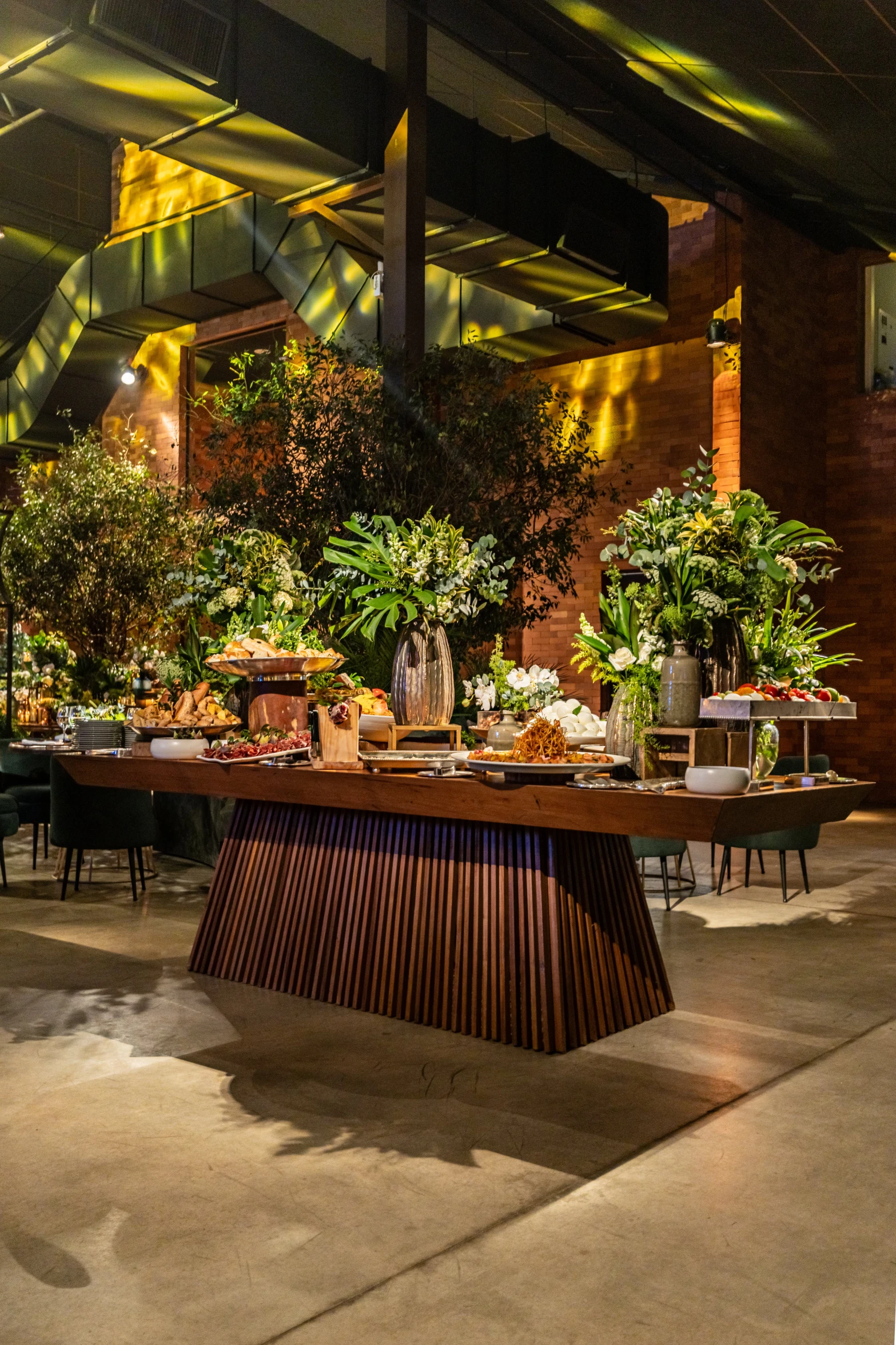 several potted plants are on a wooden table