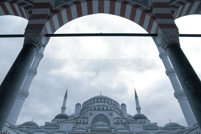 a mosque with arches opening into the sky